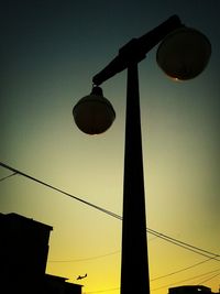 Low angle view of power lines against sky