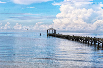 Pier over sea against sky