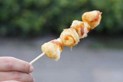 Close-up of hand holding ice cream