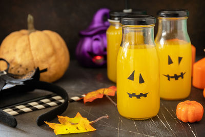 Close-up of yellow and pumpkin on table