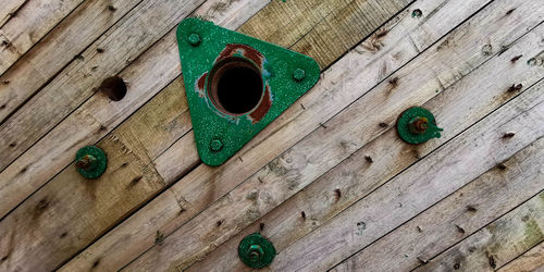 High angle view of old wooden plank on table