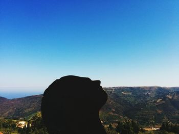 Scenic view of landscape against clear blue sky