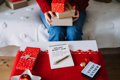 Cropped hand of woman holding gift box