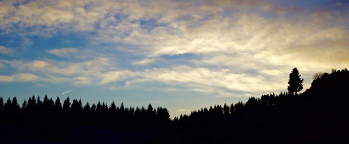 Scenic view of landscape against cloudy sky