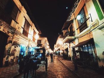 Narrow alley in city at night