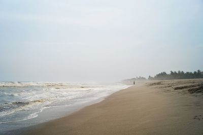 Scenic view of beach against clear sky