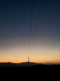 Silhouette landscape against sky during sunset