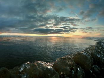 Scenic view of sea against sky during sunset