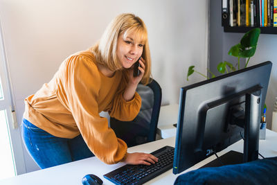 Young woman using laptop at home