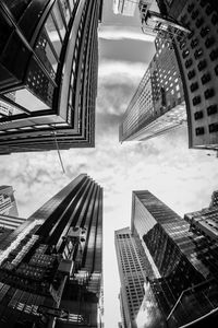 Directly below shot of modern buildings against sky