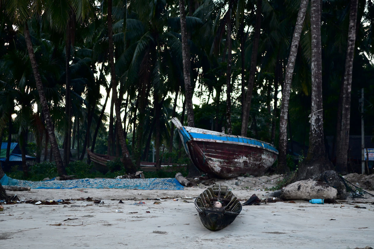 ABANDONED BOAT MOORED ON LAND