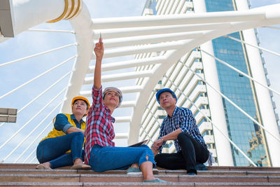 People sitting on wall
