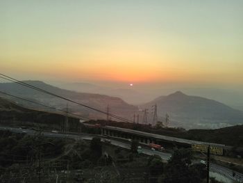 Scenic view of mountains against sky during sunset