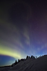 Low angle view of mountain against sky at night