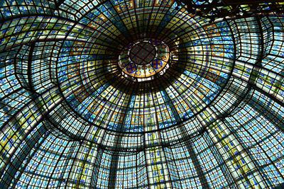 Low angle view of glass ceiling in building