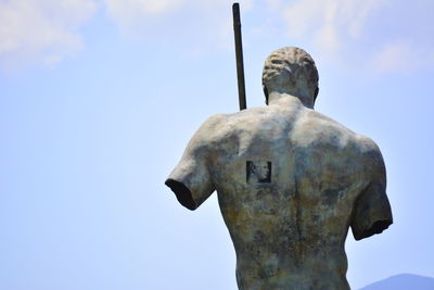 Low angle view of statue against sky