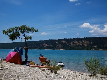 Scenic view of beach against blue sky