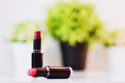 Close-up of red wine bottle on table