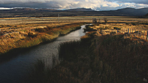 Scenic view of river and mountains