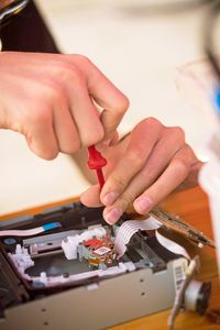 Close-up of hands working on table