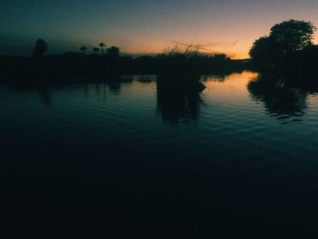 Scenic view of lake at sunset