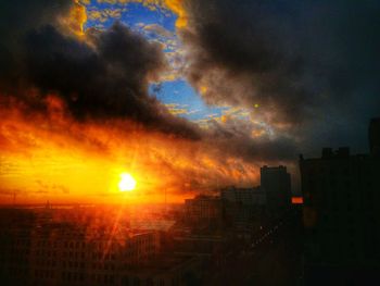 Cityscape against sky during sunset