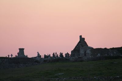 Old building against sky during sunset