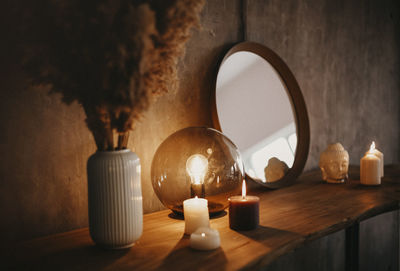 Close-up of tea light candles on table