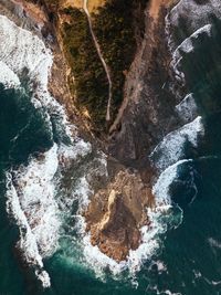 Aerial view of mountain by sea