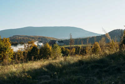 Small village in carpathian mountains. autumn landscape