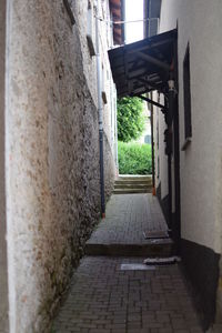 Narrow walkway leading to narrow alley