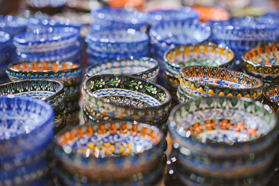 Traditional turkish ceramics, pottery, bowl at the bazaar. selective focus and blurred background. 