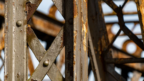 Closeup of rusty support beam of abandoned railway bridge