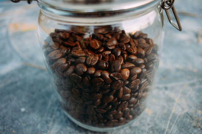 Close-up of roasted coffee beans in jar