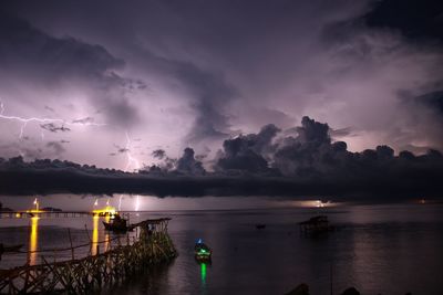 Scenic view of sea against sky at night