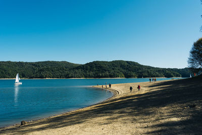 Scenic view of sea against clear blue sky