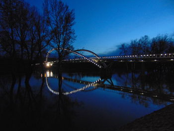 Bridge over river at night