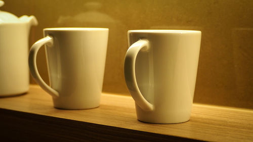 Close-up of empty coffee cup on table