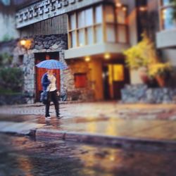 Woman standing on city street