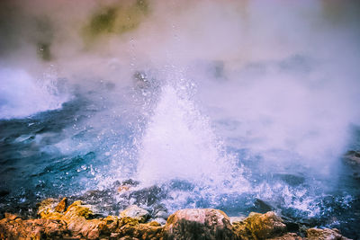 Waves splashing on rocks