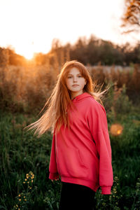 Young woman standing on field