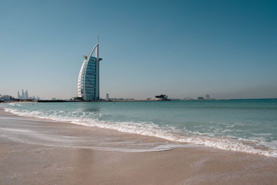 Scenic view of beach against clear sky