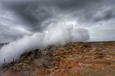 Scenic view of landscape against cloudy sky