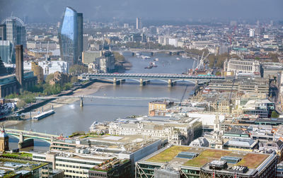 High angle view of river amidst buildings in city