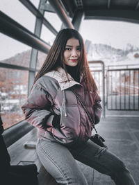 Portrait of young woman in park