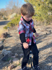 Full length of boy standing on field