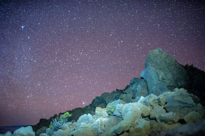 Stars shine among volcano at haleakala national park, hawaii usa