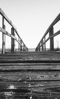 Surface level of pier against clear sky