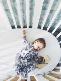 Cute baby lying on bed