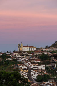 High angle view of buildings against sky during sunset